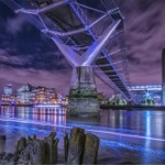 The Millennium Bridge at night, London, England.