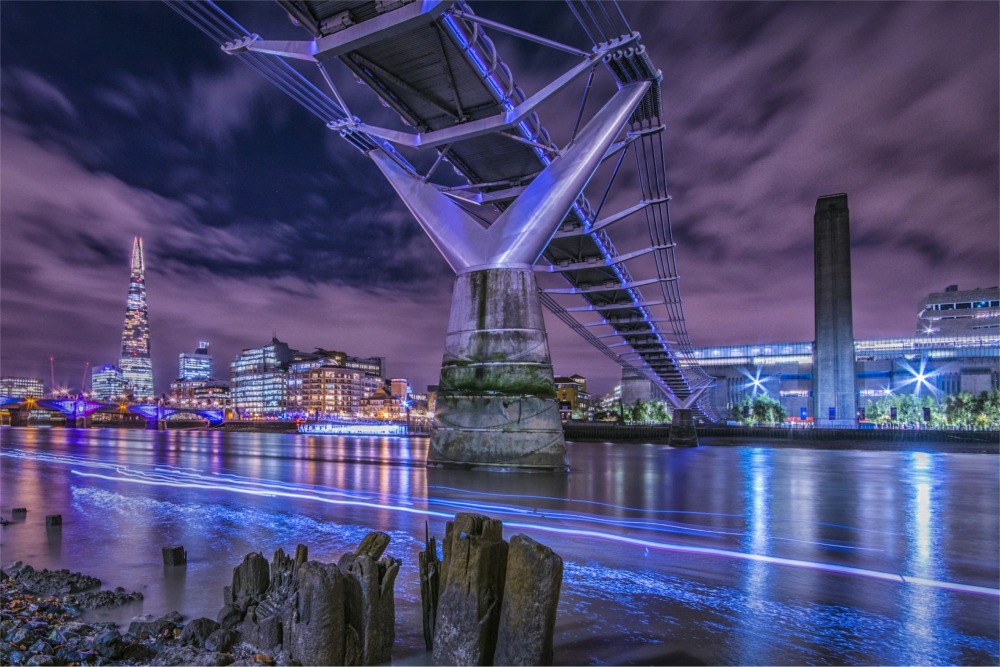 The Millennium Bridge at night, London, England.