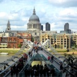 The Millennium Bridge, the River Thames and buildings in front of St Paul's Cathedral in London, England.