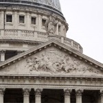 The exterior architectural and sculptural details of St Paul's Cathedral's western facade in London, England.