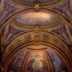 Murals on the ceiling of St Paul's Cathedral in London England above the high altar.