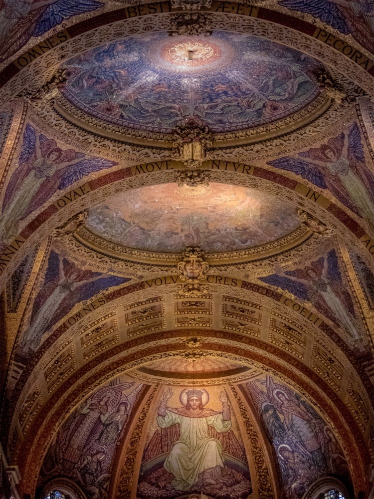 Murals on the ceiling of St Paul's Cathedral in London England above the high altar.