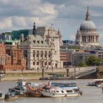 Cityscape of the northern bank of the River Thames & St Paul's Cathedral in London England.