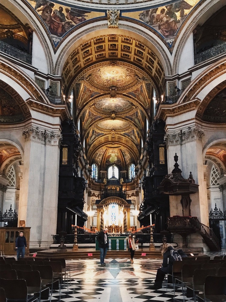 This is a photograph taken from the nave of St Paul's Cathedral in London England looking east toward the choir and high altar.