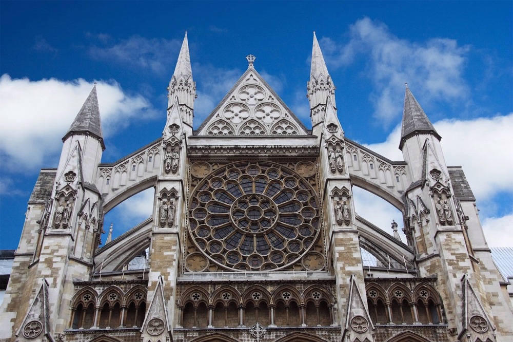This is a low-angle photograph showing lots of detail in the northern facade of Westminster Abbey in London, England.