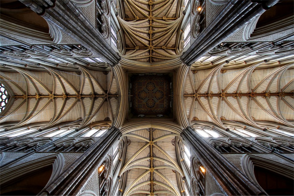 We see the stunning ribbed vaulted ceiling and Gothic architecture of Westminster Abbey in this beautiful photograph.