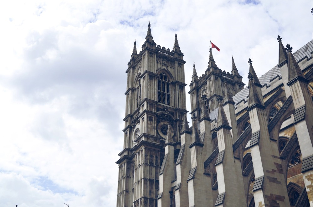 This low-angle photograph shows exterior flying buttresses on the southern facade of Westminster Abbey in London, England.