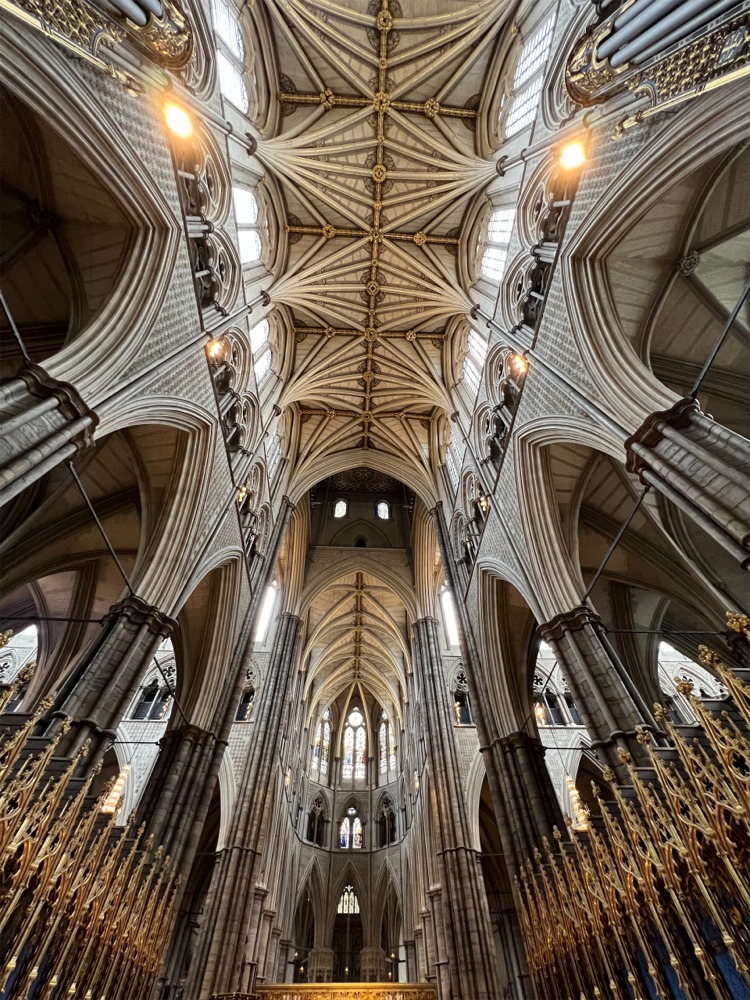 Westminster Abbey in London, England including the Quire, the ribbed vault ceiling, and the intersection of the North and South Transepts.